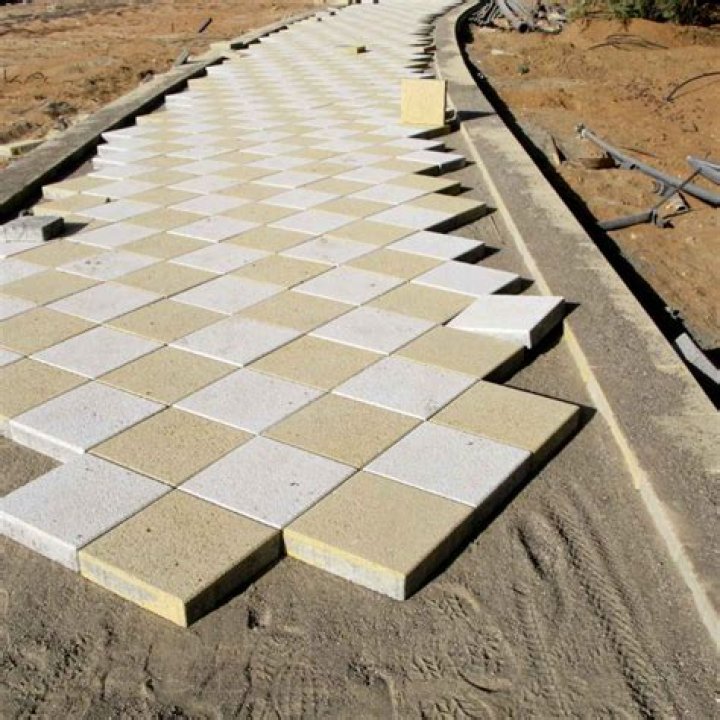 Can you lay paving slabs on existing concrete?